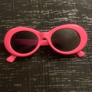 Non branded pink rounded sunglasses. Used a few times.Unisex